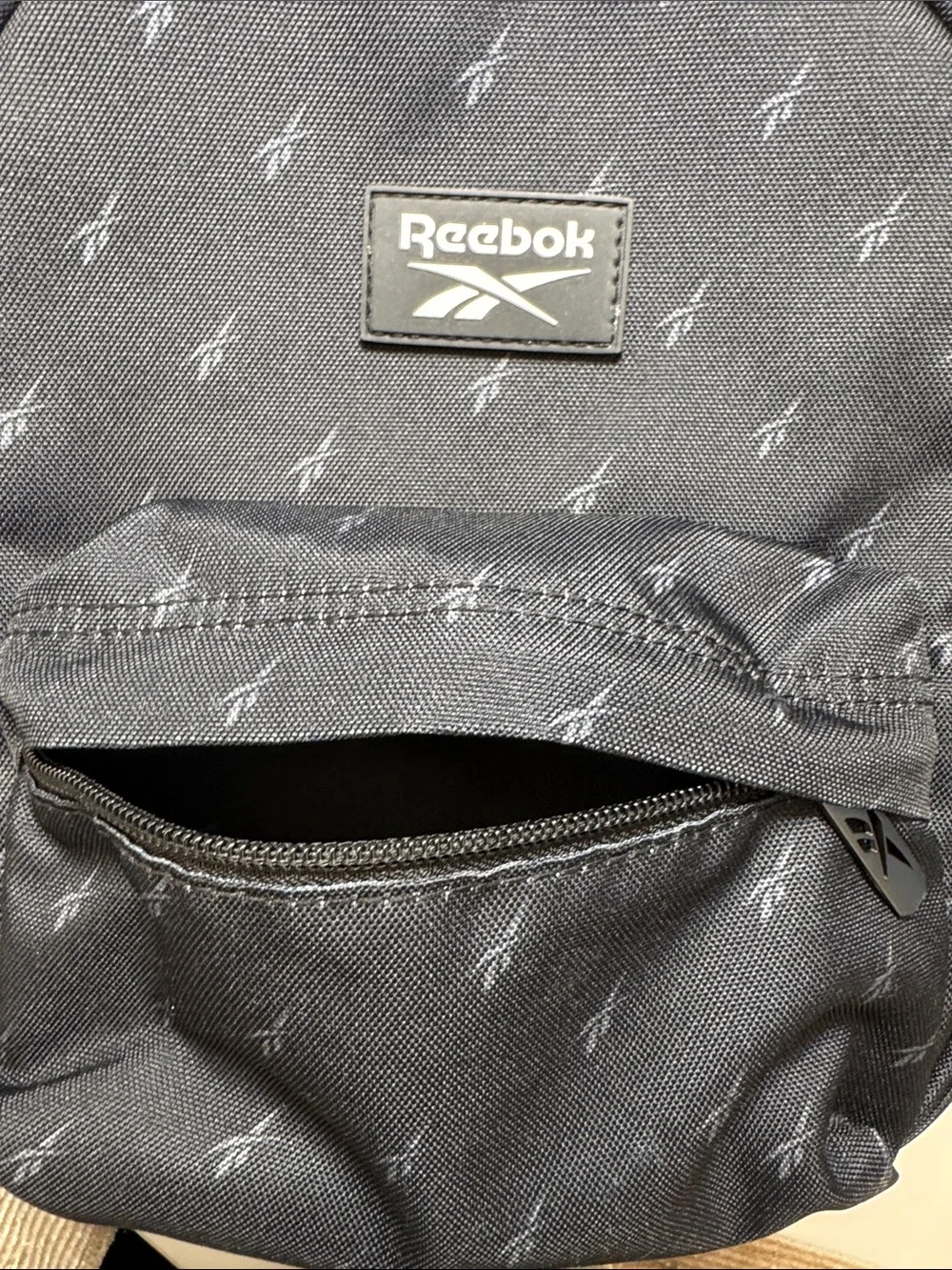 Reebok Black Mini Backpack with Subtle Logo Print. Excellent Condition